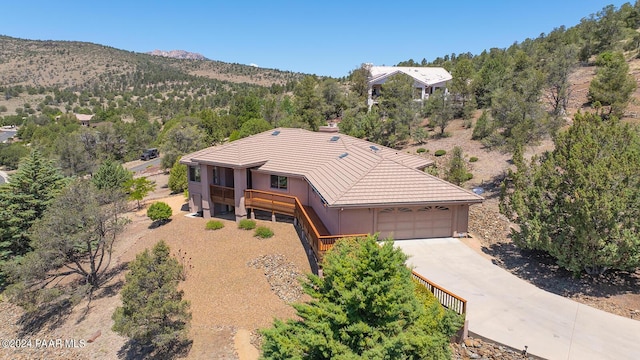 birds eye view of property with a mountain view