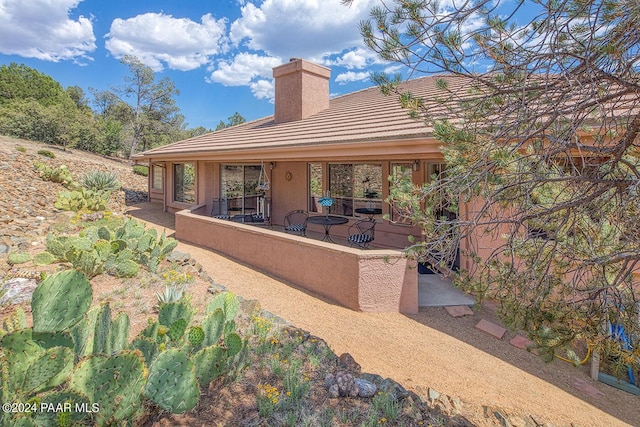 rear view of house with a patio area