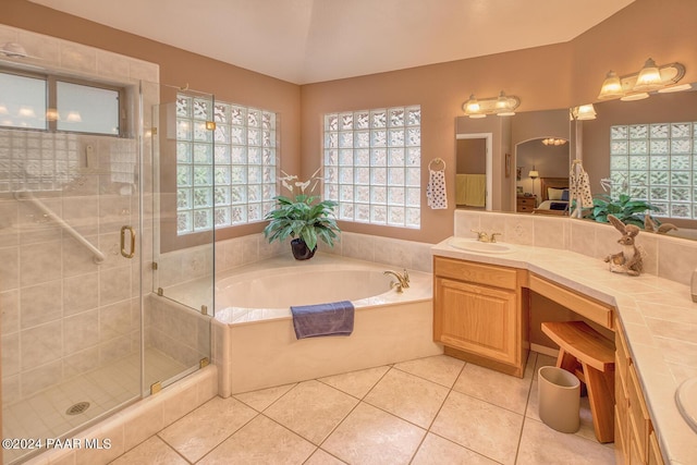 bathroom featuring vanity, tile patterned floors, and separate shower and tub