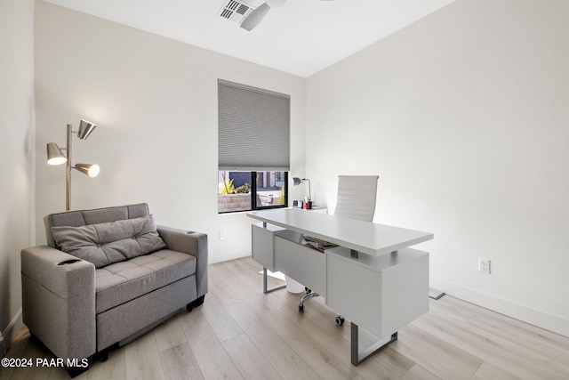 office area with ceiling fan and light hardwood / wood-style flooring