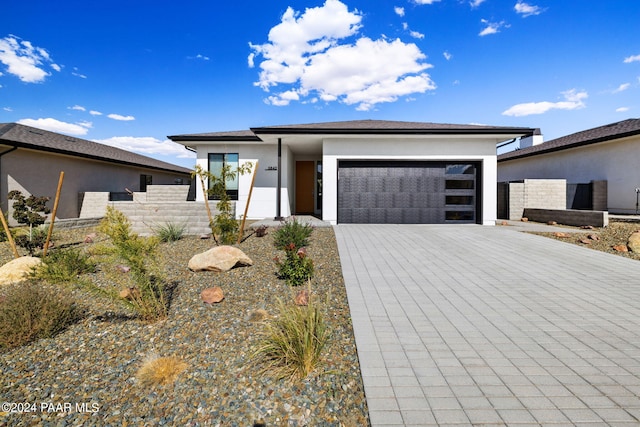 prairie-style home featuring a garage