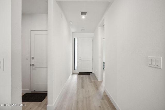 hallway featuring light hardwood / wood-style flooring