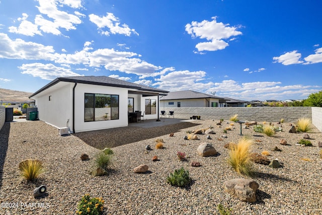 rear view of property with a patio area