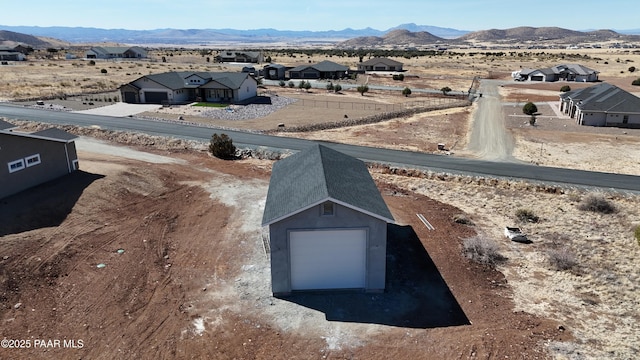 view of storm shelter featuring a residential view and a mountain view