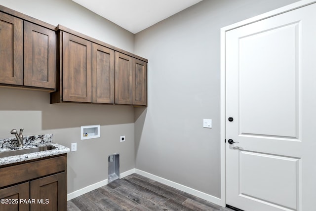 clothes washing area with sink, dark wood-type flooring, cabinets, hookup for an electric dryer, and hookup for a washing machine