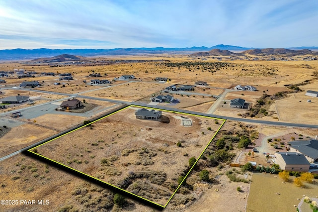 bird's eye view with a desert view, a rural view, and a mountain view