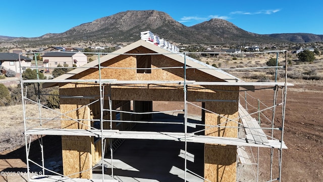 view of horse barn with a mountain view