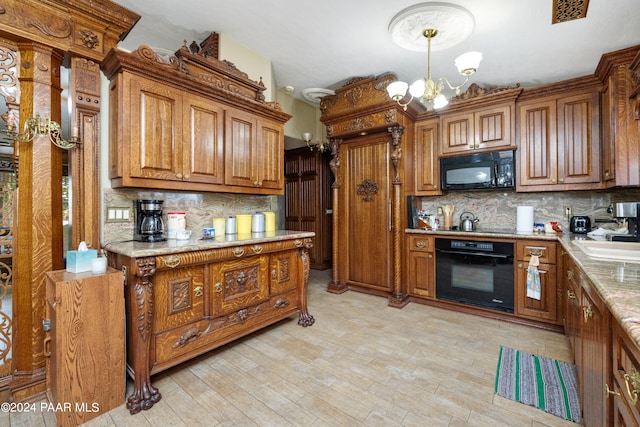 kitchen with decorative backsplash, light hardwood / wood-style flooring, black appliances, and a notable chandelier