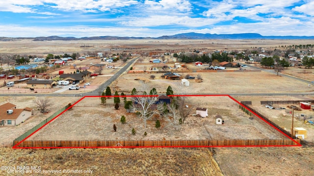 birds eye view of property with a mountain view