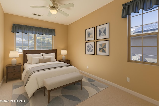 bedroom featuring baseboards, visible vents, ceiling fan, and carpet floors