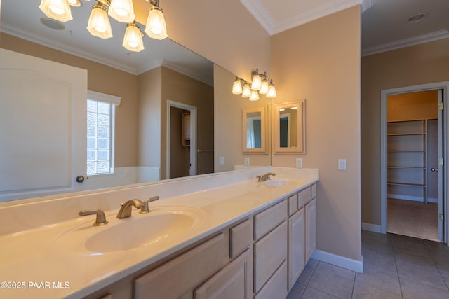 full bath featuring double vanity, baseboards, tile patterned flooring, and a sink