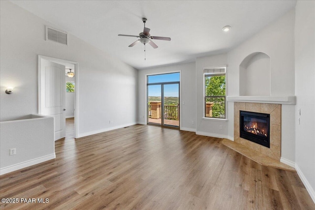 532 Goshawk Trl, Prescott, AZ 86301 - unfurnished living room with ceiling fan, a fireplace, wood finished floors, and lofted ceiling