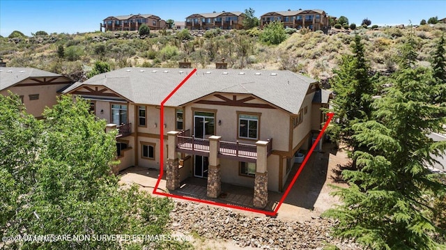 532 Goshawk Trl, Prescott, AZ 86301 - back of property with stucco siding, a patio area, and a balcony