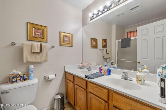 4034 N Sheridan Ln, Prescott Valley, AZ 86314 - bathroom featuring double vanity, an enclosed shower, and toilet