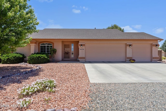 4034 N Sheridan Ln, Prescott Valley, AZ 86314 - single story home featuring a garage, driveway, and stucco siding