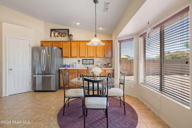 4034 N Sheridan Ln, Prescott Valley, AZ 86314 - dining space featuring vaulted ceiling, light tile patterned flooring, and baseboards