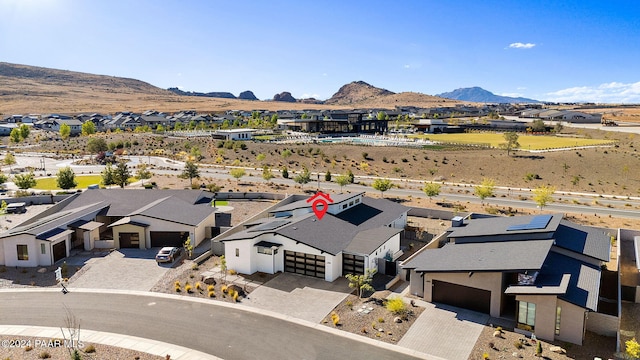 birds eye view of property with a mountain view