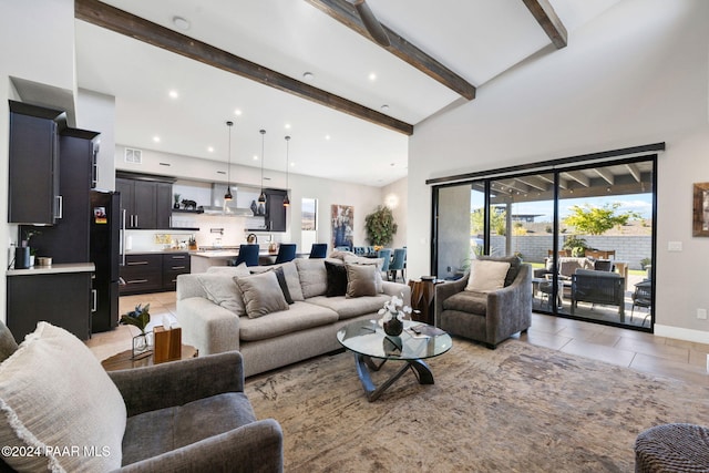 tiled living room featuring beamed ceiling