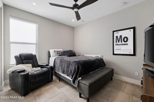 bedroom with multiple windows and ceiling fan