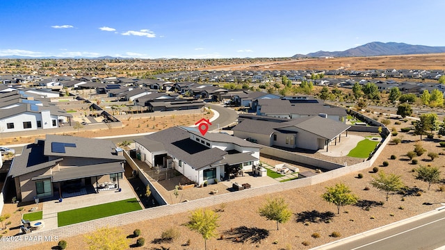 birds eye view of property featuring a mountain view