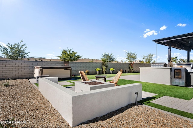 view of yard with area for grilling and an outdoor fire pit