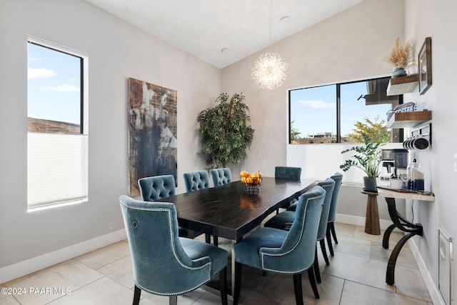 tiled dining space featuring an inviting chandelier