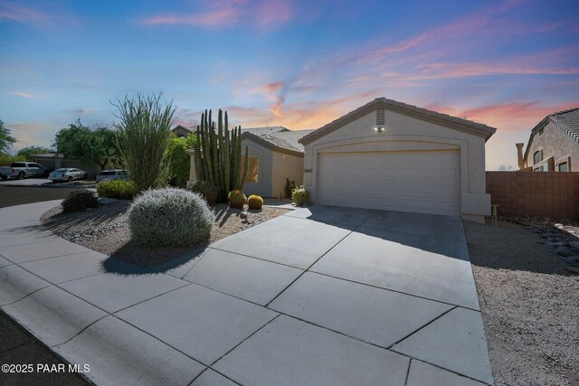 26647 N 43rd St, Cave Creek, AZ 85331 - ranch-style home featuring driveway, an attached garage, and stucco siding