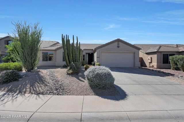 26647 N 43rd St, Cave Creek, AZ 85331 - ranch-style home with an attached garage, driveway, stucco siding, and a tiled roof