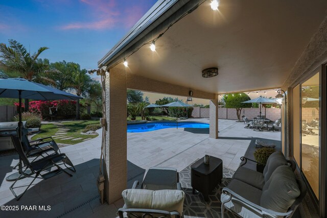 26647 N 43rd St, Cave Creek, AZ 85331 - patio terrace at dusk featuring a patio area, a fenced backyard, and outdoor dining area