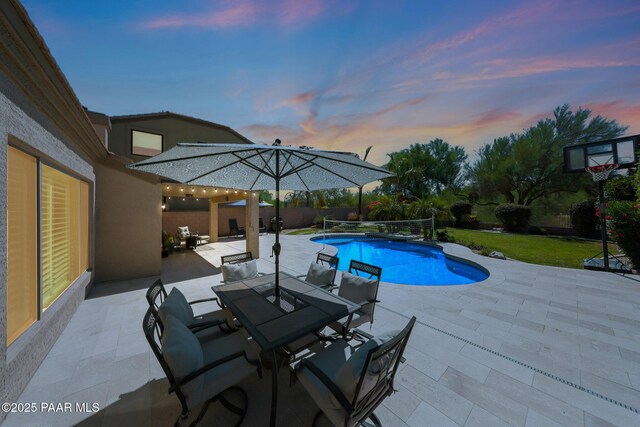 26647 N 43rd St, Cave Creek, AZ 85331 - pool at dusk featuring a patio, an outdoor pool, outdoor dining space, and a fenced backyard