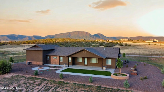 9192 N Doc Bar Rd, Prescott Valley, AZ 86315 - view of front of home featuring a patio and a mountain view