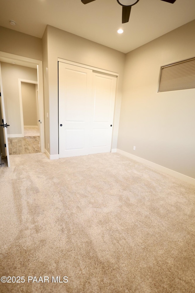 9192 N Doc Bar Rd, Prescott Valley, AZ 86315 - unfurnished bedroom with carpet floors, a closet, baseboards, and recessed lighting