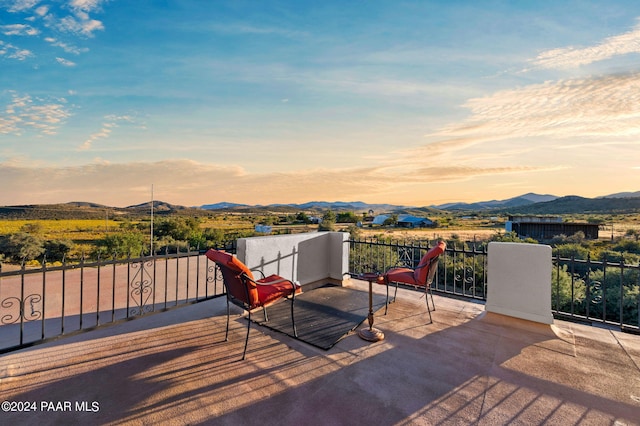 deck at dusk with a mountain view