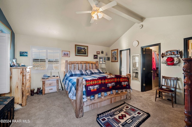 bedroom featuring vaulted ceiling with beams, ceiling fan, a spacious closet, and carpet floors