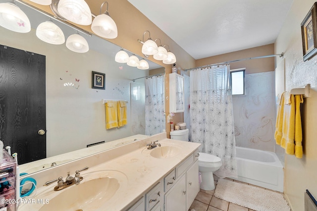 full bathroom featuring tile patterned flooring, vanity, toilet, and shower / tub combo