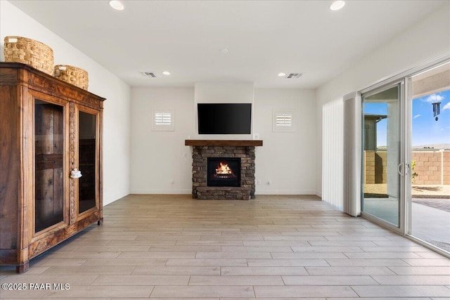 8935 N Tromontana Rd, Prescott Valley, AZ 86315 - unfurnished living room featuring light wood finished floors, recessed lighting, a fireplace, and baseboards