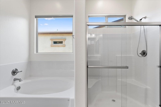 8935 N Tromontana Rd, Prescott Valley, AZ 86315 - full bathroom featuring a shower stall, plenty of natural light, and a bath