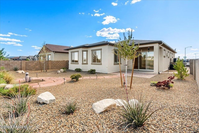 8935 N Tromontana Rd, Prescott Valley, AZ 86315 - back of house featuring a fenced backyard, a patio, and stucco siding