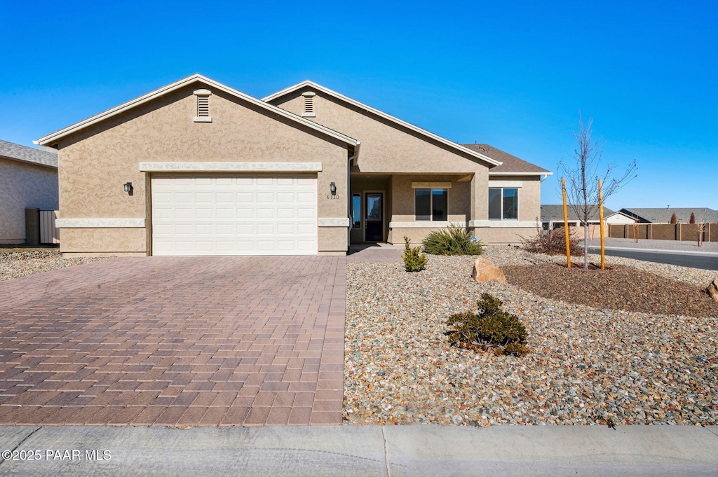 single story home featuring a garage