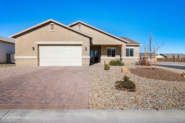 single story home featuring a garage