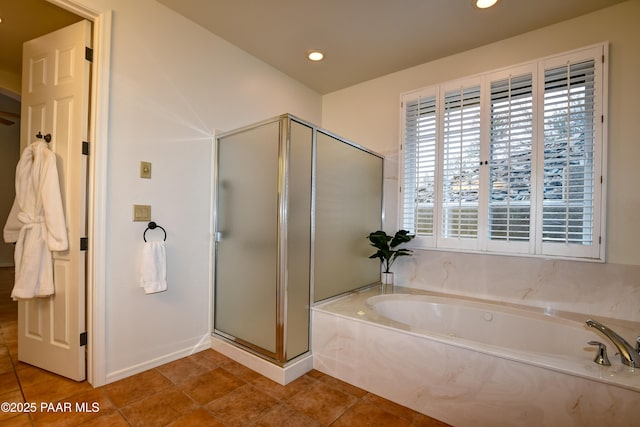 bathroom with tile patterned flooring, a shower stall, a garden tub, and recessed lighting