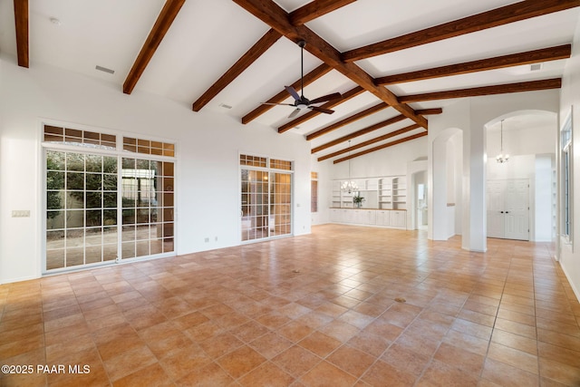 unfurnished living room with visible vents, beamed ceiling, high vaulted ceiling, ceiling fan with notable chandelier, and arched walkways