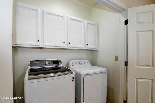 laundry area featuring cabinet space and independent washer and dryer