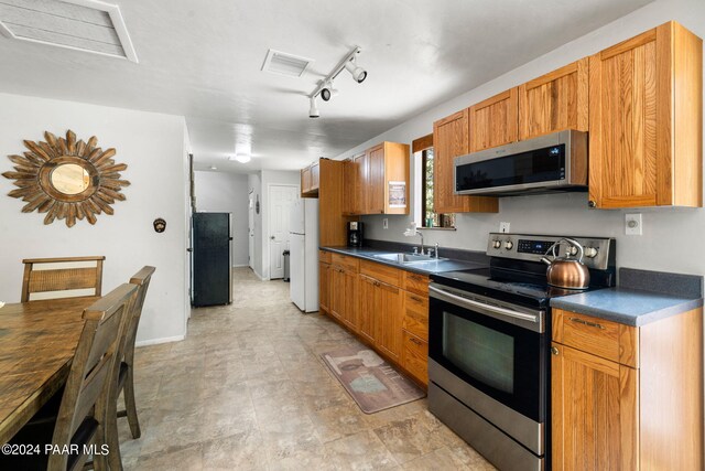 kitchen featuring sink and appliances with stainless steel finishes