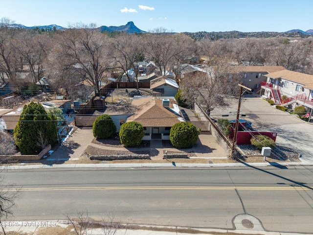 birds eye view of property featuring a mountain view and a residential view