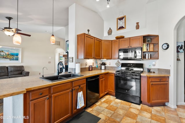 kitchen featuring sink, decorative light fixtures, kitchen peninsula, ceiling fan, and black appliances