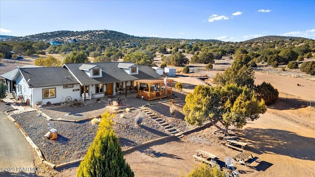 view of front of home featuring a mountain view