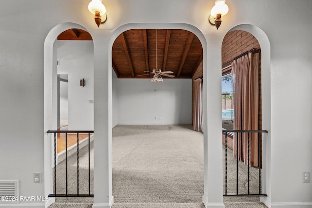 hall with carpet flooring and wooden ceiling