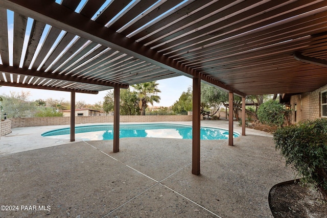 view of swimming pool featuring a pergola and a patio