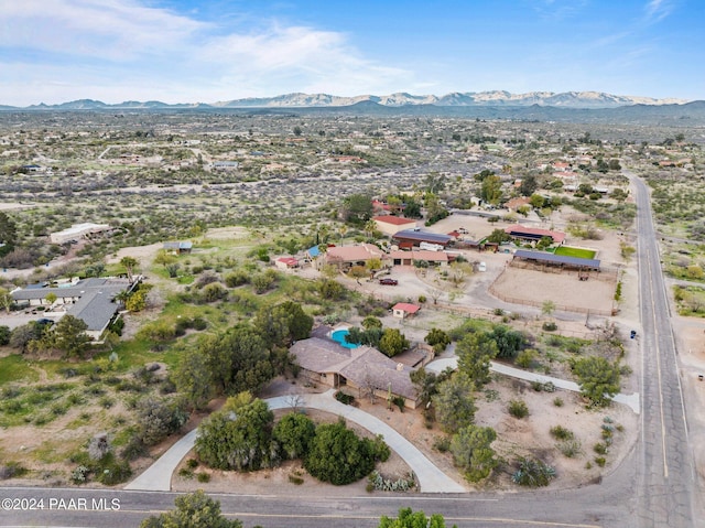 birds eye view of property with a mountain view